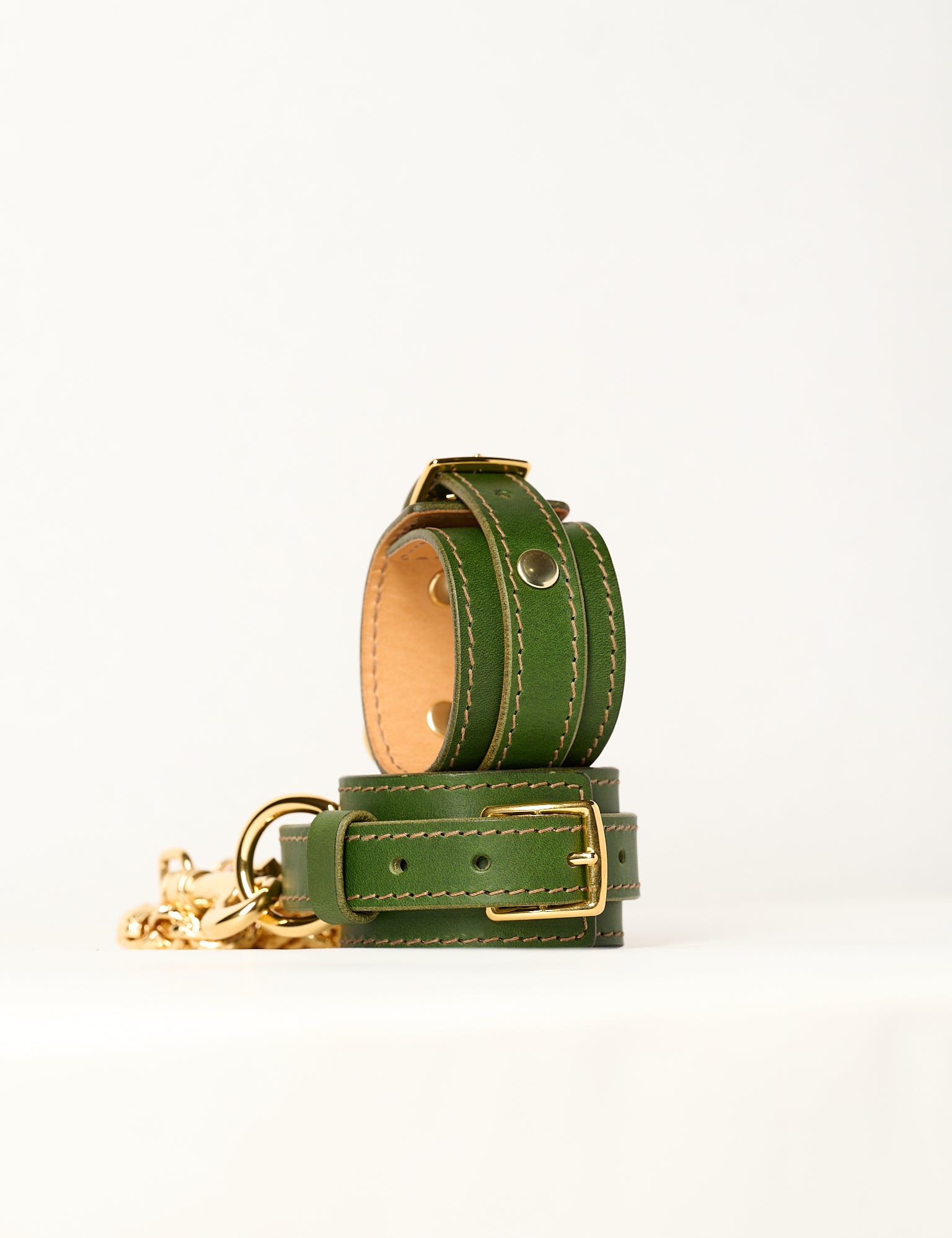 green leather bracelets and gold chain