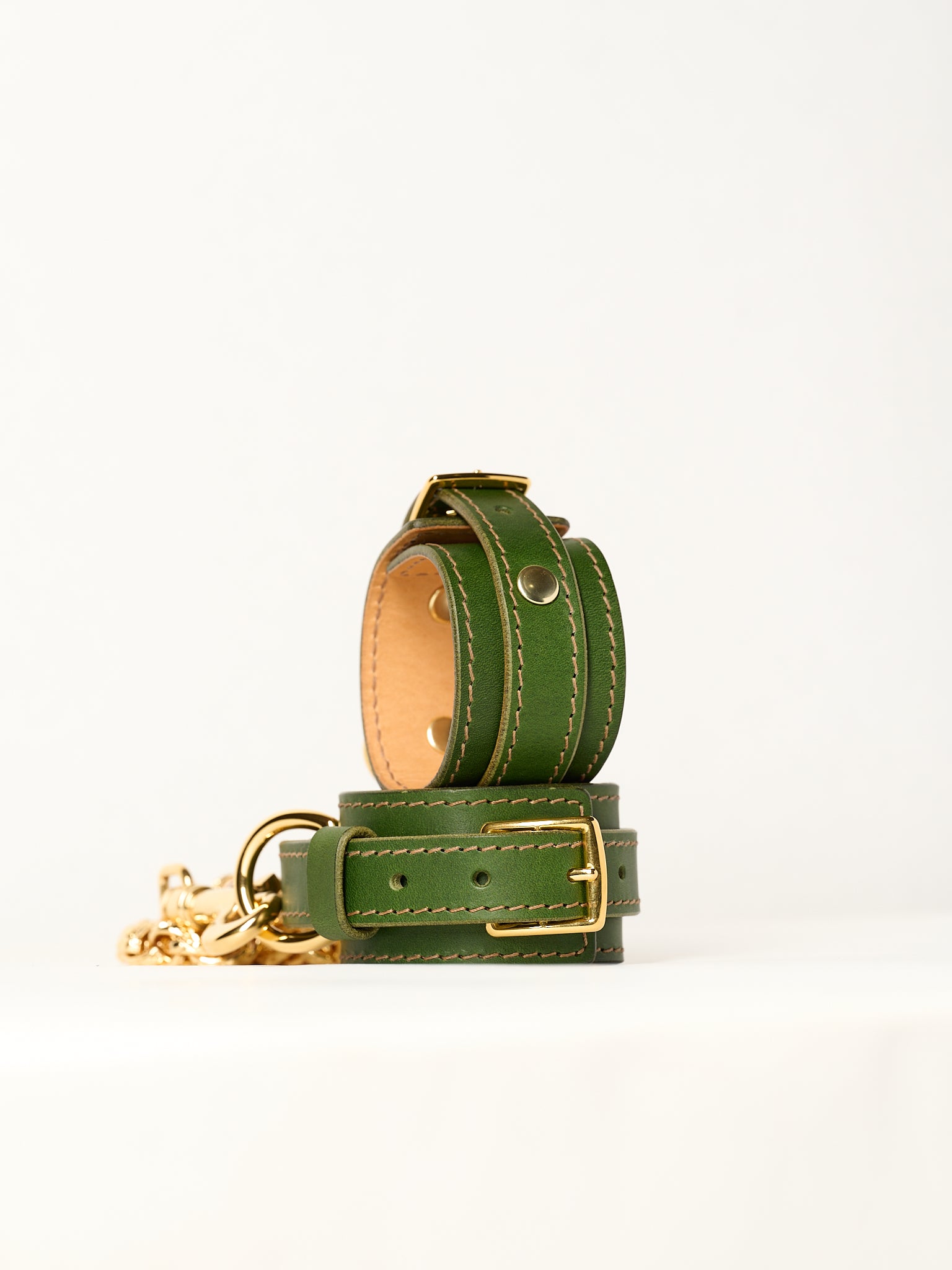 green leather bracelets and gold chain