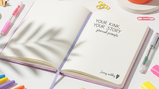 Open notebook with 'Your Kink Your Story' journal prompts on a white background with stationery items.