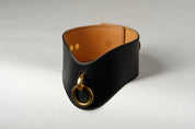 black and light brown leather wide necklace choker with gold pendant on white background