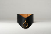 black and light brown leather wide necklace choker with gold pendant on white background