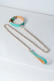 blue leather necklace with silver stainless steel chain and pendant on white background