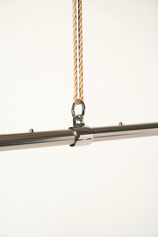metal adjustable bar attached with o-ring to jute rope